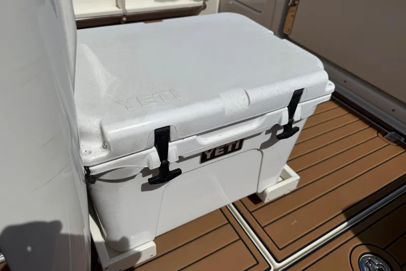 Slide: The Image of YETI cooler on 2023 Boston Whaler 280 Outrage boat deck. - 29