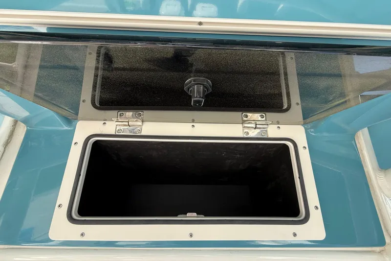 Slide: The Image of Open storage compartment on 2023 Boston Whaler 280 Outrage boat. - 37