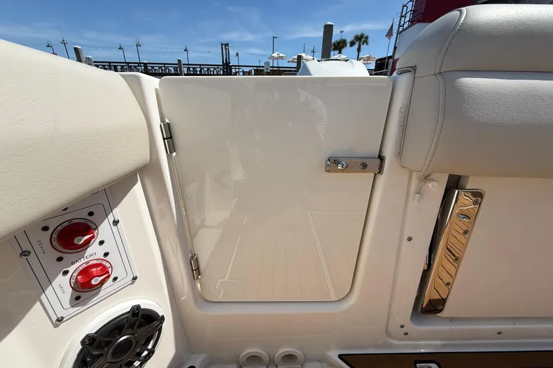 Slide: The Image of 2023 Boston Whaler 280 Outrage boat interior, featuring control panel and seating. - 44