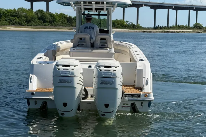 Slide: The Image of 2023 Boston Whaler 280 Outrage with twin 350 engines on water. - 5