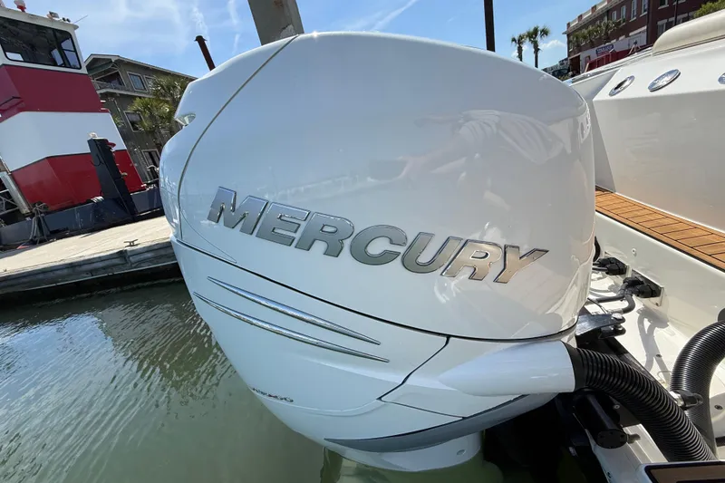 Slide: The Image of 2023 Boston Whaler 280 Outrage with Mercury engine at dockside. - 9