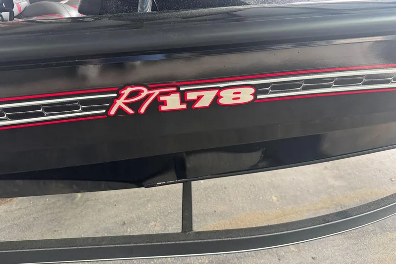 Slide: The Image of 2021 Ranger RT178 boat logo in red on black surface. - 11