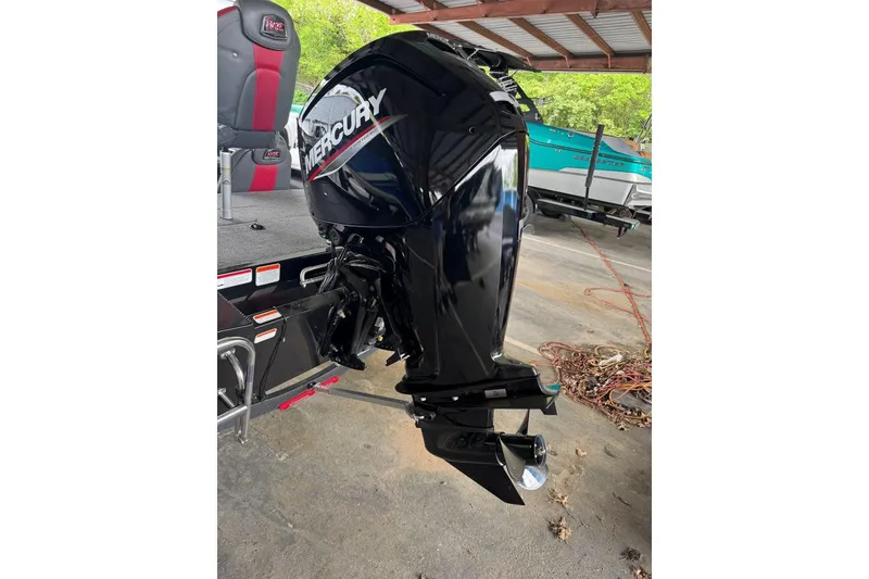 Slide: The Image of 2021 Ranger RT178 boat with Mercury outboard motor in a covered area. - 14