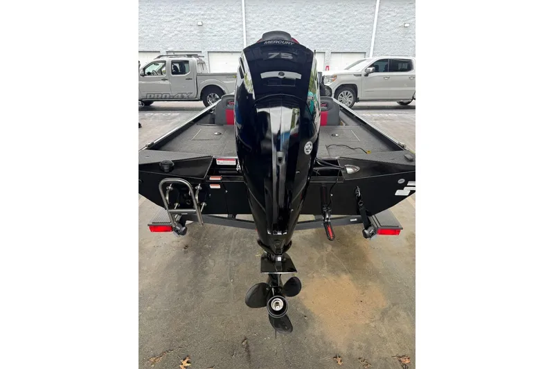 Slide: The Image of 2021 Ranger RT178 boat with Mercury 75 engine, parked outdoors. - 15