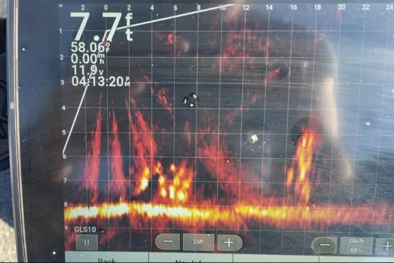 Slide: The Image of Fishfinder display on a 2021 Ranger RT178 boat, showing sonar data and depth. - 19
