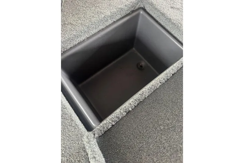 Slide: The Image of Storage compartment in 2021 Ranger RT178 boat, featuring a carpeted interior. - 26