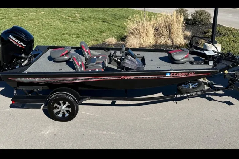 Slide: The Image of 2021 Ranger RT178 boat with Mercury engine on a trailer, parked outdoors. - 3