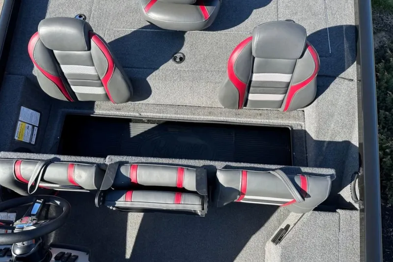 Slide: The Image of 2021 Ranger RT178 boat interior with gray and red seating, showcasing spacious design. - 32