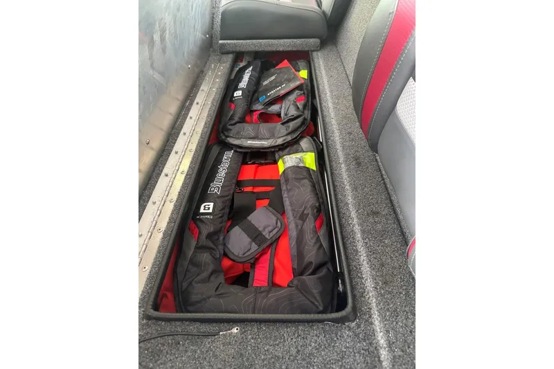 Slide: The Image of Storage compartment in 2021 Ranger RT178 boat with life jackets neatly organized. - 33