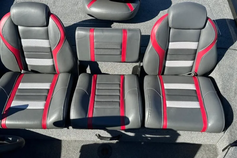 Slide: The Image of 2021 Ranger RT178 boat seats with gray, red, and white upholstery. - 34