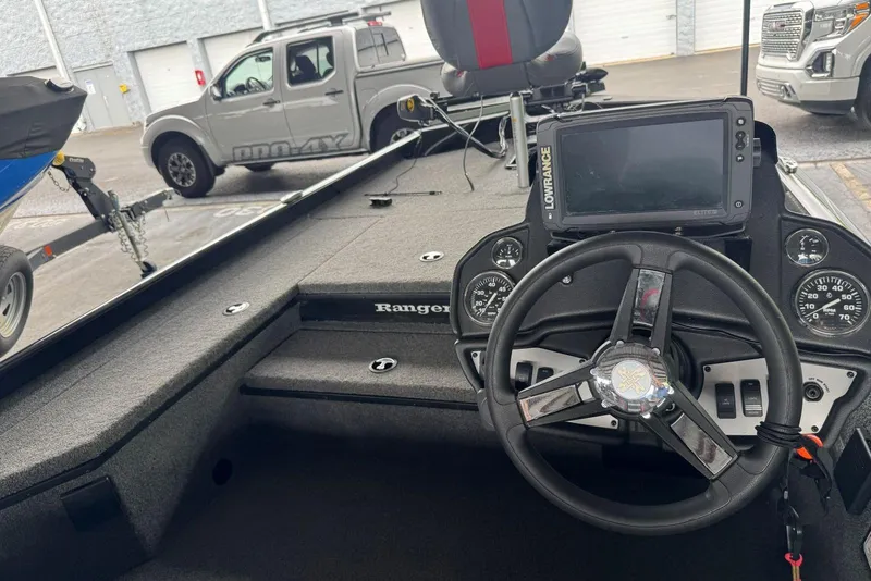Slide: The Image of 2021 Ranger RT178 boat interior with steering wheel and Lowrance navigation system. - 35