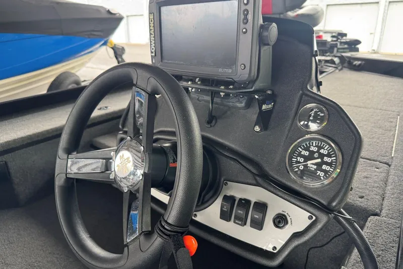 Slide: The Image of 2021 Ranger RT178 boat dashboard with steering wheel, gauges, and Lowrance Elite fishfinder. - 36
