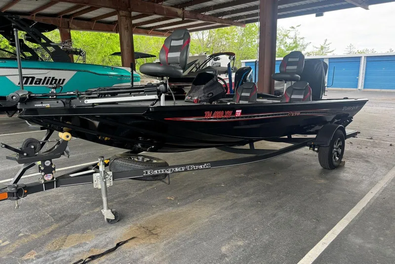 Slide: The Image of 2021 Ranger RT178 fishing boat on trailer in covered storage area. - 6