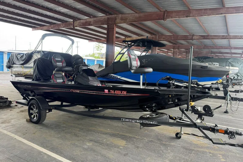 Slide: The Image of 2021 Ranger RT178 boat on trailer in covered storage area. - 9
