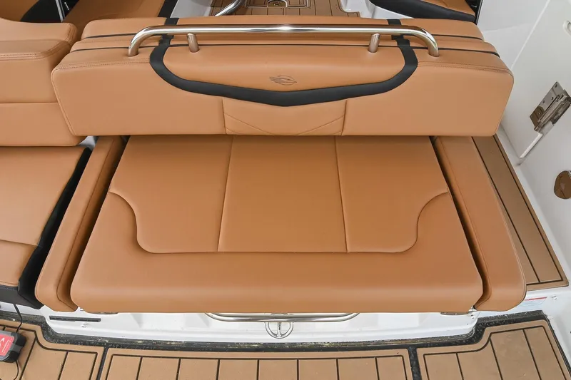 Slide: The Image of 2022 Chaparral 307 SSX boat with tan leather seating and stainless steel accents. - 10