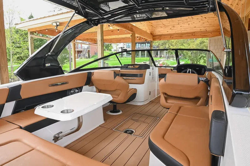 Slide: The Image of 2022 Chaparral 307 SSX boat interior with luxurious seating and modern design. - 14