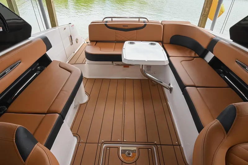Slide: The Image of Luxurious interior of 2022 Chaparral 307 SSX boat with tan seating and sleek design. - 15