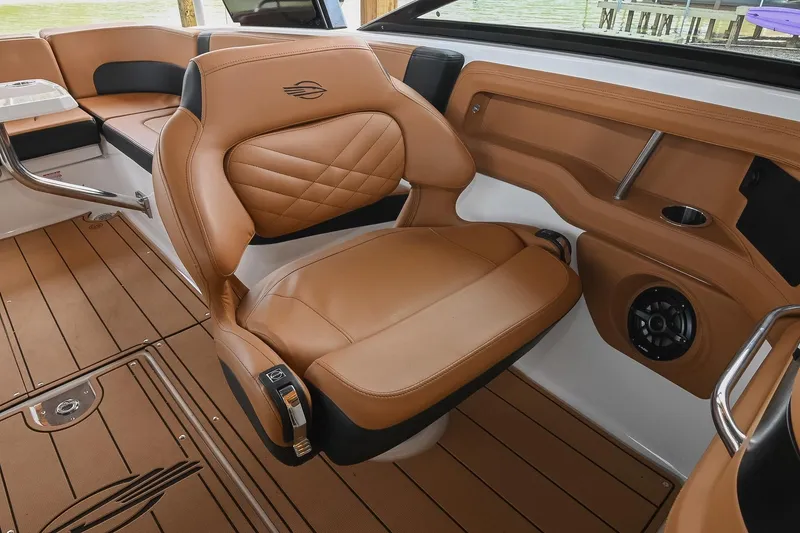 Slide: The Image of Luxurious interior of 2022 Chaparral 307 SSX boat with tan leather seating. - 28
