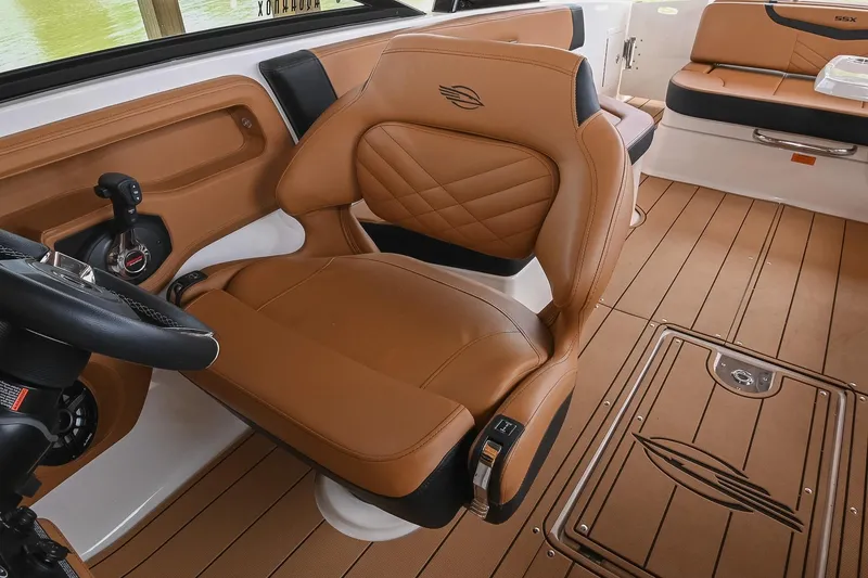 Slide: The Image of Luxurious interior of 2022 Chaparral 307 SSX boat with tan leather seating. - 29