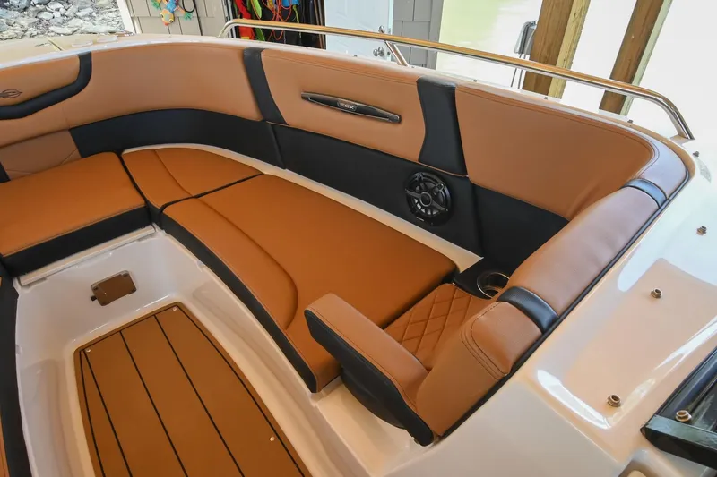 Slide: The Image of Luxurious interior of 2022 Chaparral 307 SSX boat with tan and black seating. - 34