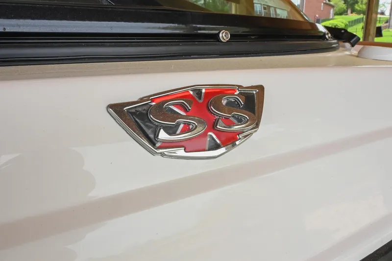 Slide: The Image of 2022 Chaparral 307 SSX emblem on a sleek white surface. - 6