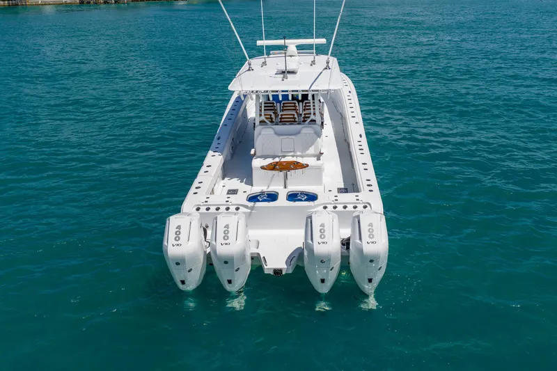 Slide: The Image of 2025 Freeman 43 boat with quad V10 engines on clear blue water. - 12