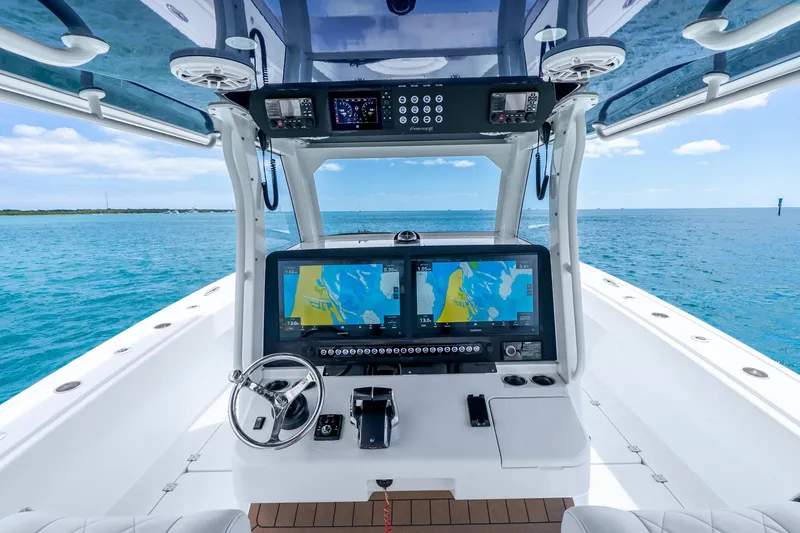 Slide: The Image of Cockpit view of 2025 Freeman 43 boat with advanced navigation system on open water. - 22