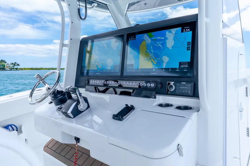 Slide: The Image of Helm of 2025 Freeman 43 boat with advanced navigation displays and controls. - 23