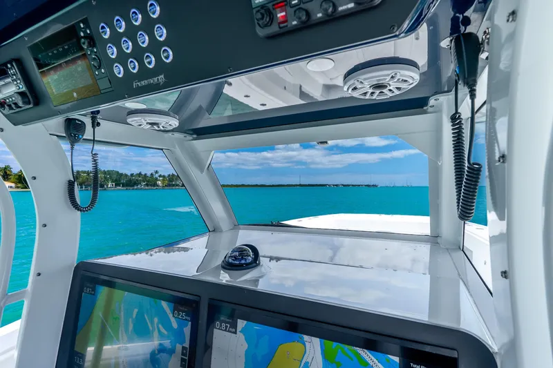 Slide: The Image of Interior view of 2025 Freeman 43 boat cockpit with navigation screens and ocean view. - 25