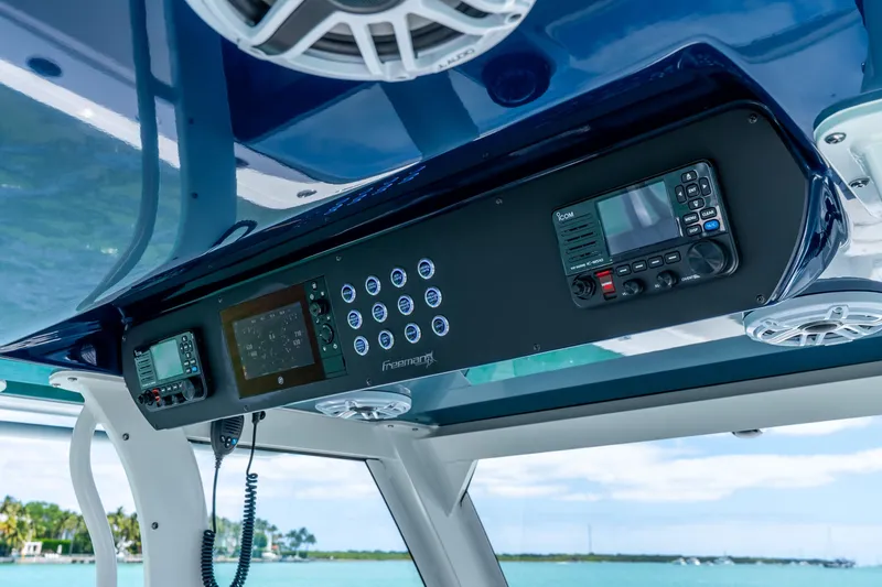 Slide: The Image of Freeman 43 boat dashboard with advanced controls and navigation systems, 2025 model. - 26
