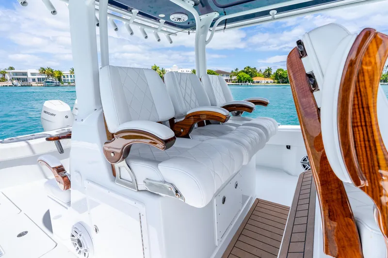 Slide: The Image of Luxurious seating on a 2025 Freeman 43 boat with scenic waterfront view. - 28