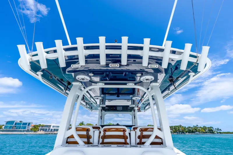 Slide: The Image of 2025 Freeman 43 boat with advanced canopy design against a clear blue sky. - 29