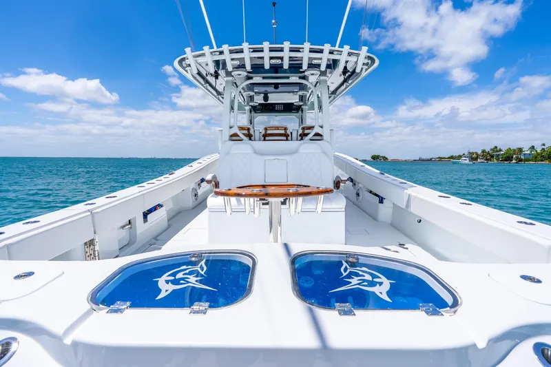 Slide: The Image of 2025 Freeman 43 boat on open water, featuring sleek design and spacious deck. - 30