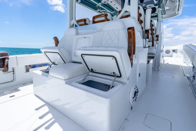 Slide: The Image of Luxurious 2025 Freeman 43 boat interior with white seating and storage compartments. - 34