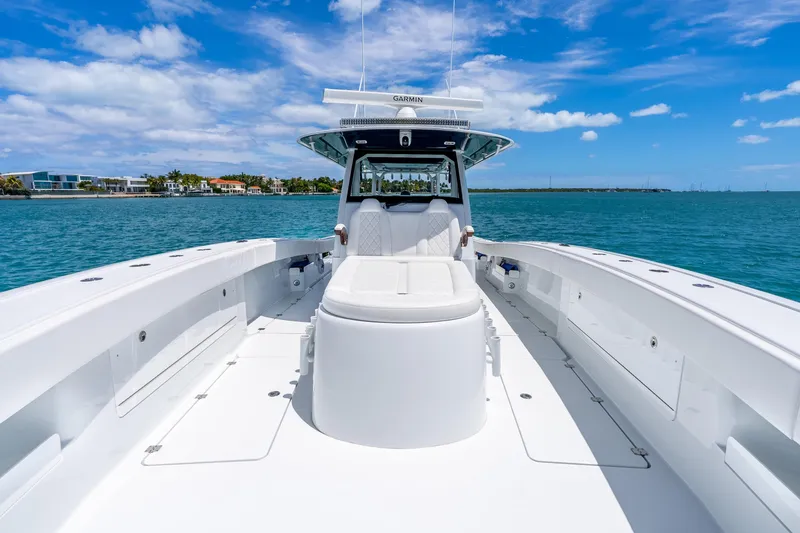 Slide: The Image of 2025 Freeman 43 boat on clear blue water under a sunny sky. - 42