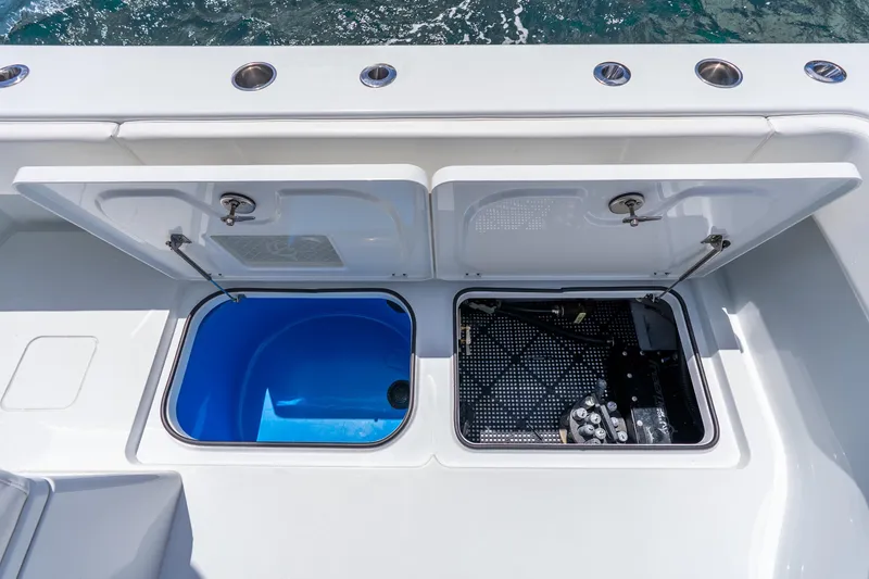 Slide: The Image of Open compartments on a 2025 Freeman 43 boat, showcasing storage and equipment access. - 51