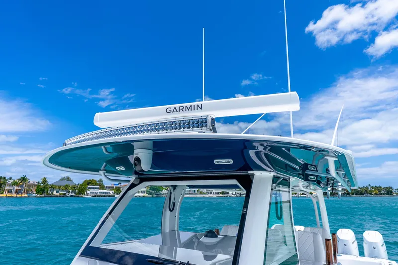 Slide: The Image of 2025 Freeman 43 boat with Garmin radar, cruising on clear blue waters under a sunny sky. - 54