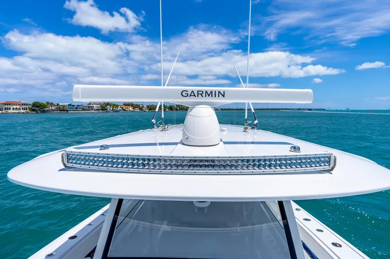 Slide: The Image of 2025 Freeman 43 boat with Garmin radar on blue ocean under clear sky. - 55
