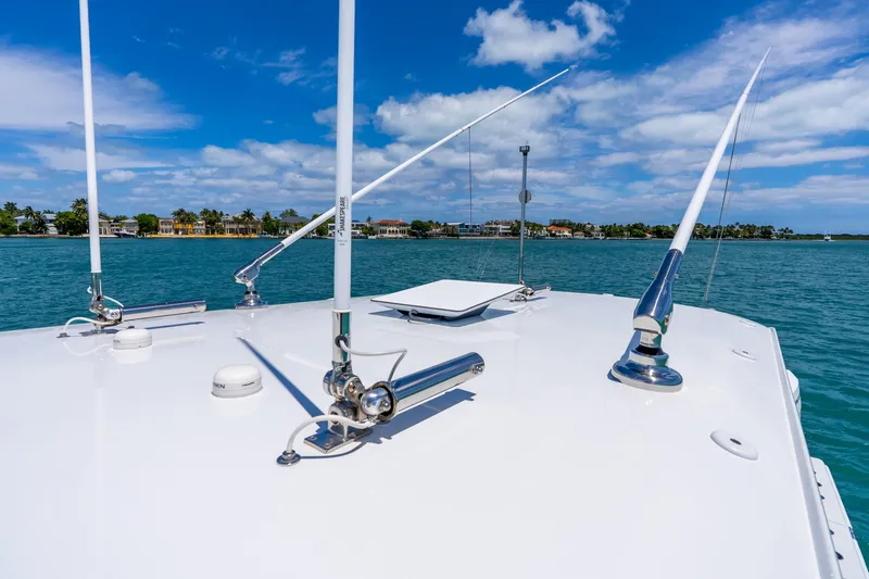 Slide: The Image of Bow view of 2025 Freeman 43 boat on clear blue water under a sunny sky. - 56