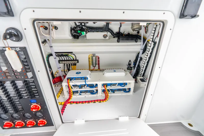 Slide: The Image of Electrical panel and wiring inside a Freeman 43 boat, model year 2025. - 60