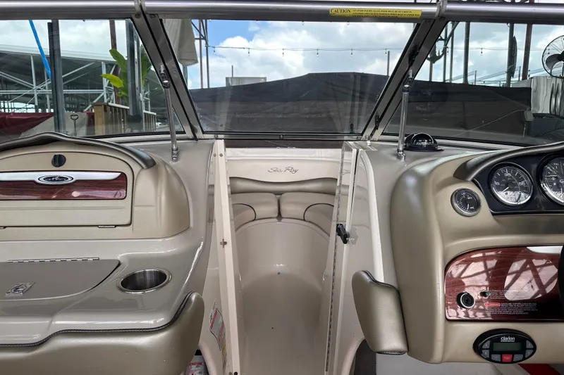 Slide: The Image of Interior view of a 2005 Sea Ray 200 Select boat dashboard with gauges and controls. - 15