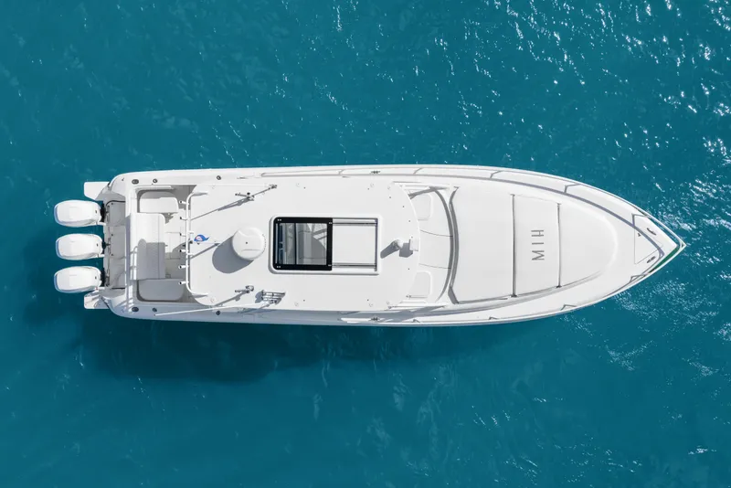 Slide: The Image of Aerial view of 2013 Intrepid 400 Cuddy boat on clear blue water. - 16