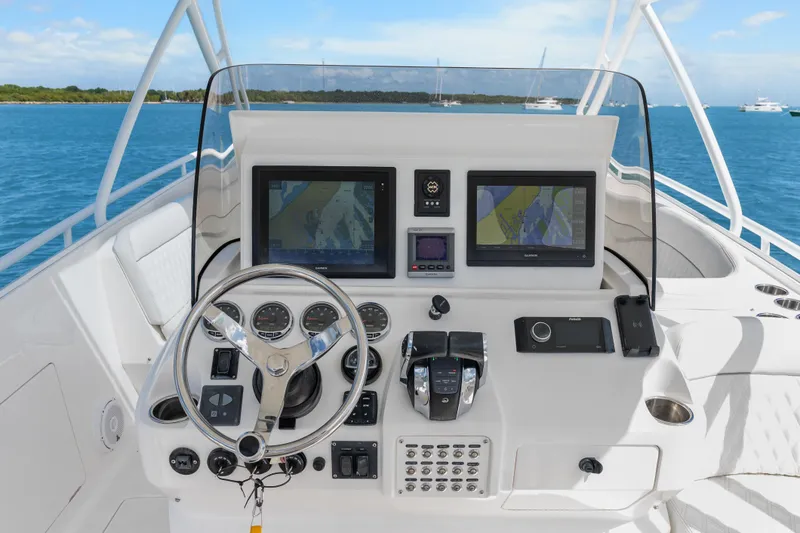 Slide: The Image of Helm of 2013 Intrepid 400 Cuddy with advanced navigation systems and controls. - 17