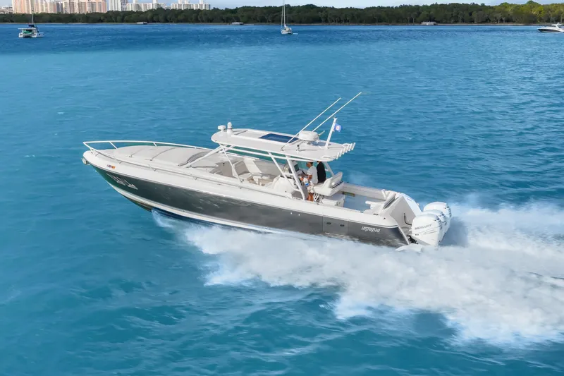 Slide: The Image of 2013 Intrepid 400 Cuddy cruising on blue ocean waters. - 2