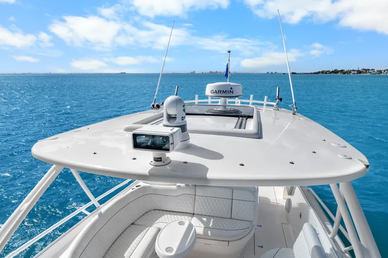 Slide: The Image of 2013 Intrepid 400 Cuddy boat with Garmin equipment on open blue sea. - 29