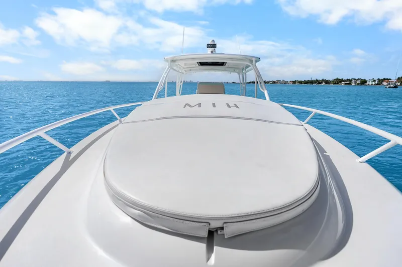 Slide: The Image of 2013 Intrepid 400 Cuddy boat cruising on clear blue water under a sunny sky. - 37