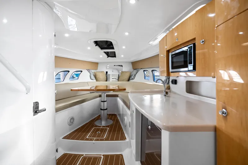 Slide: The Image of Luxurious interior of 2013 Intrepid 400 Cuddy boat with modern kitchen and seating area. - 40
