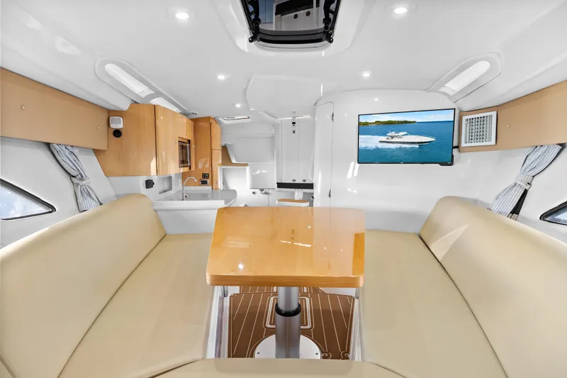 Slide: The Image of Luxurious interior of a 2013 Intrepid 400 Cuddy boat with modern amenities and elegant design. - 41