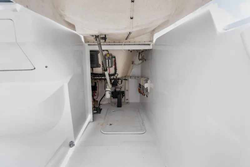 Slide: The Image of Engine compartment of a 2013 Intrepid 400 Cuddy boat, showcasing wiring and mechanical components. - 49