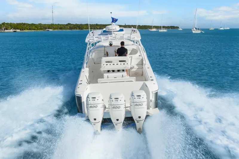 Slide: The Image of 2013 Intrepid 400 Cuddy cruising on open water with powerful engines. - 7